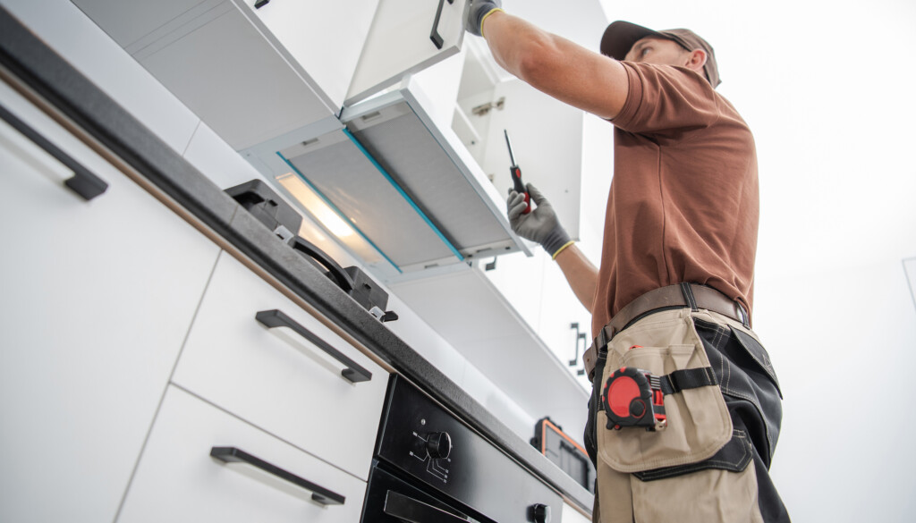 residential-cabinetmaker-worker-finishing-new-kitc-2021-12-15-20-39-38-utc